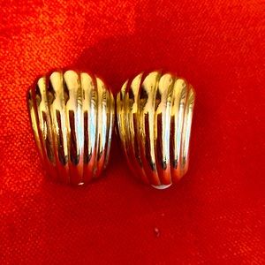 Gold tone clip earrings.